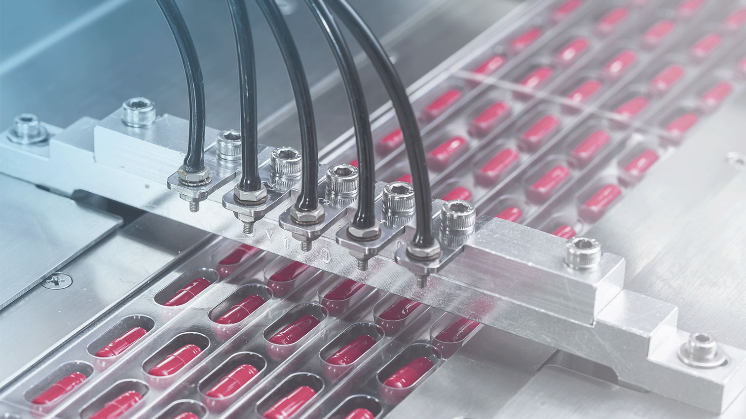 Close up of pill assembly line