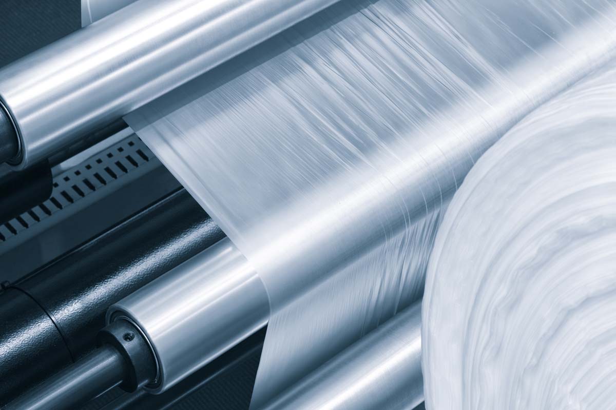 Close up of a plastic roll on production machinery