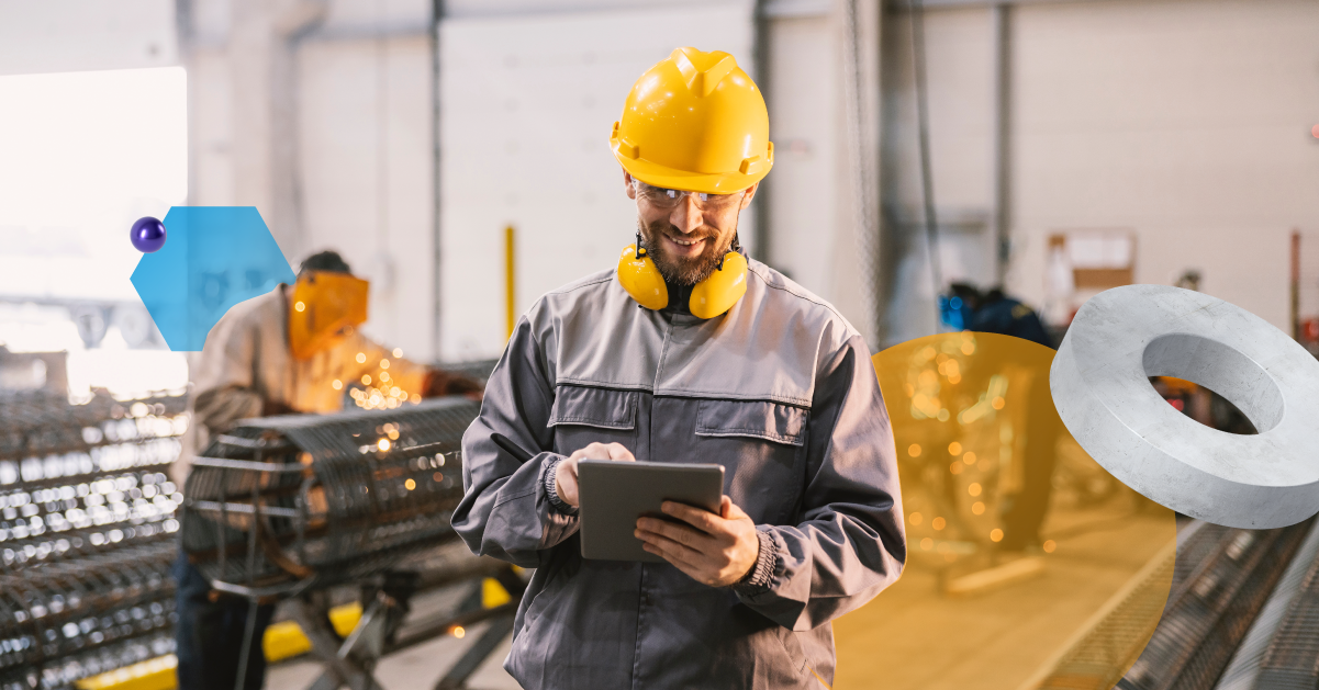 Maintenance worker in a yellow hard hat looking at a tablet