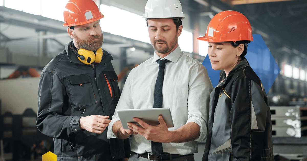 3 Maintenance workers looking at a tablet