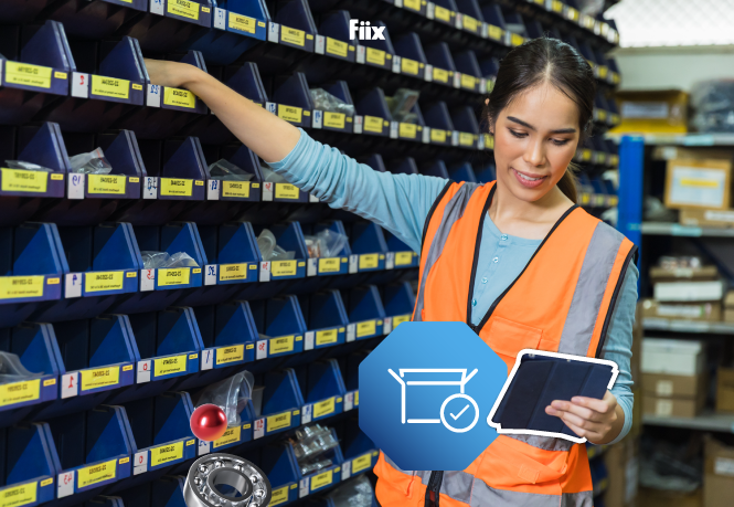 Woman in orange vest looking through inventory